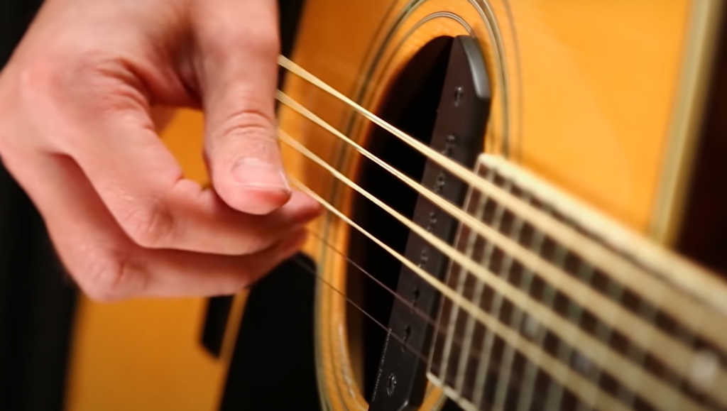 Changing strings on an acoustic guitar